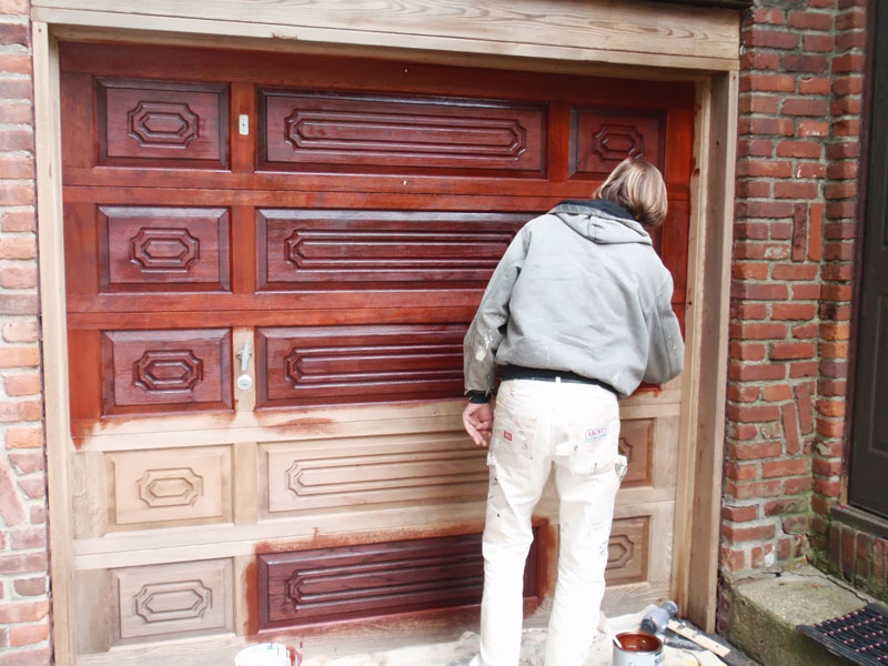 Manhasset NY - Restoration Garage Door Applying Sikens Cetol Door and Window